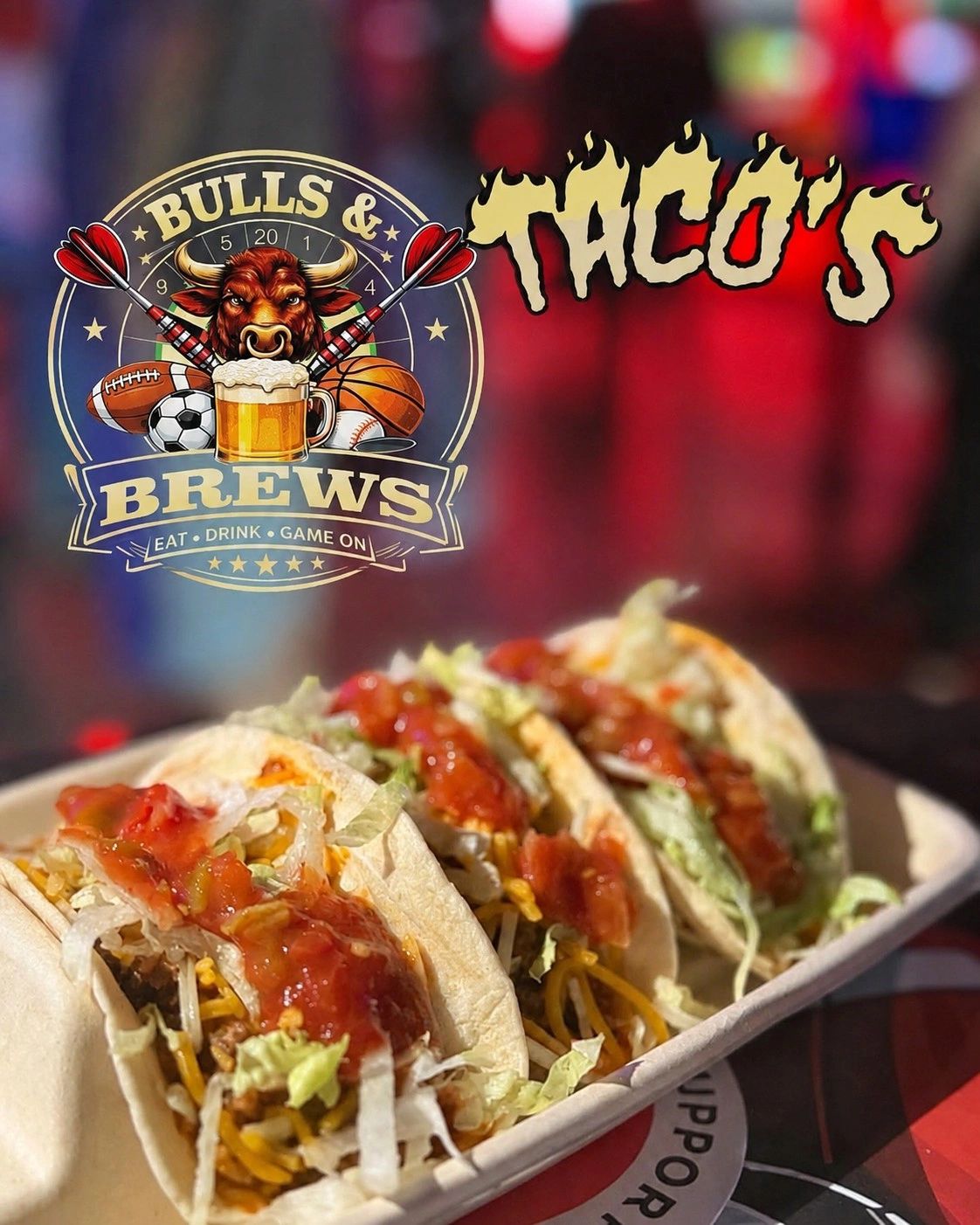 Three tacos in a tray with the Bulls & Brews logo overhead