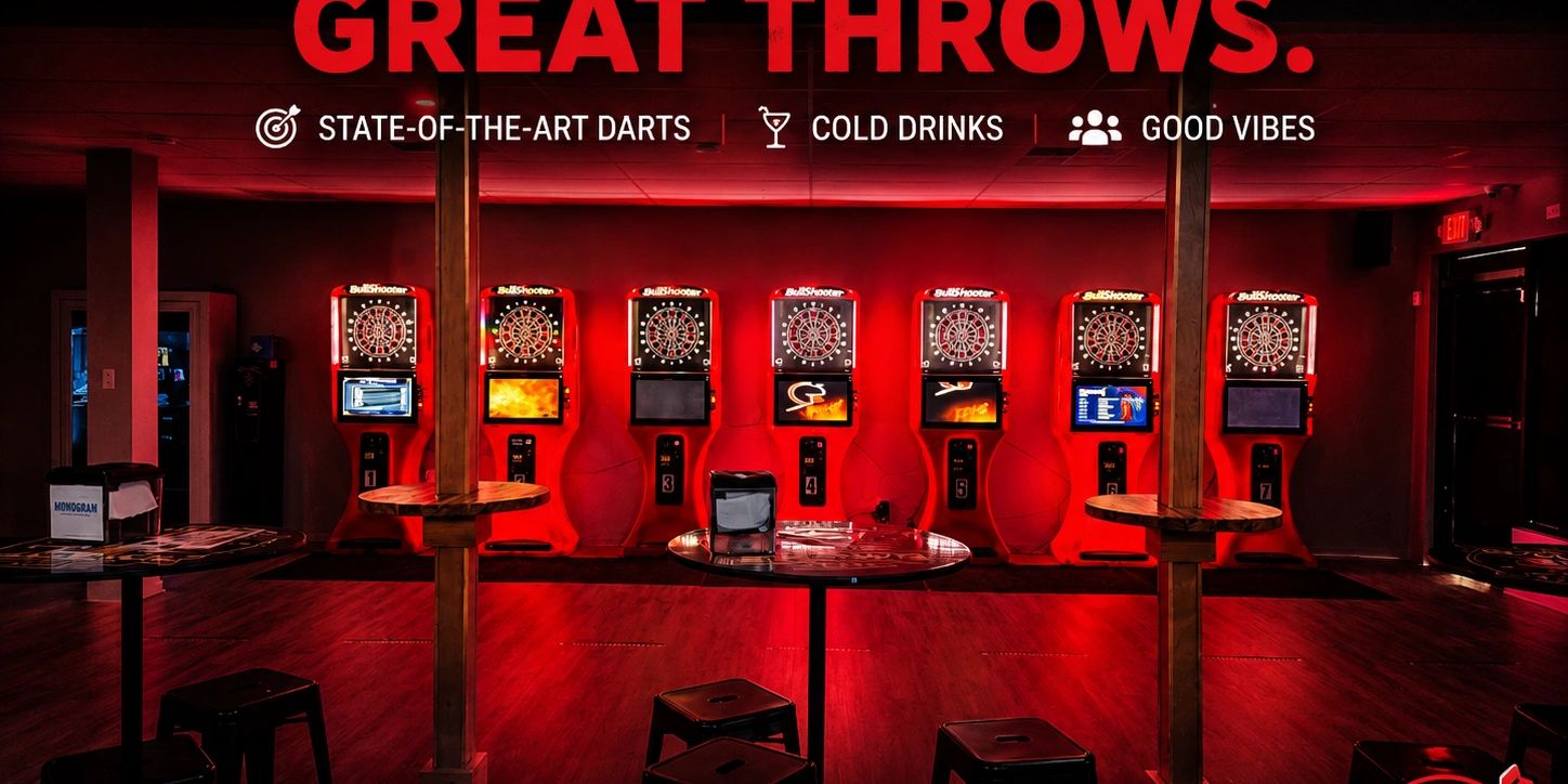 Row of electronic dart boards under a Great Throws banner